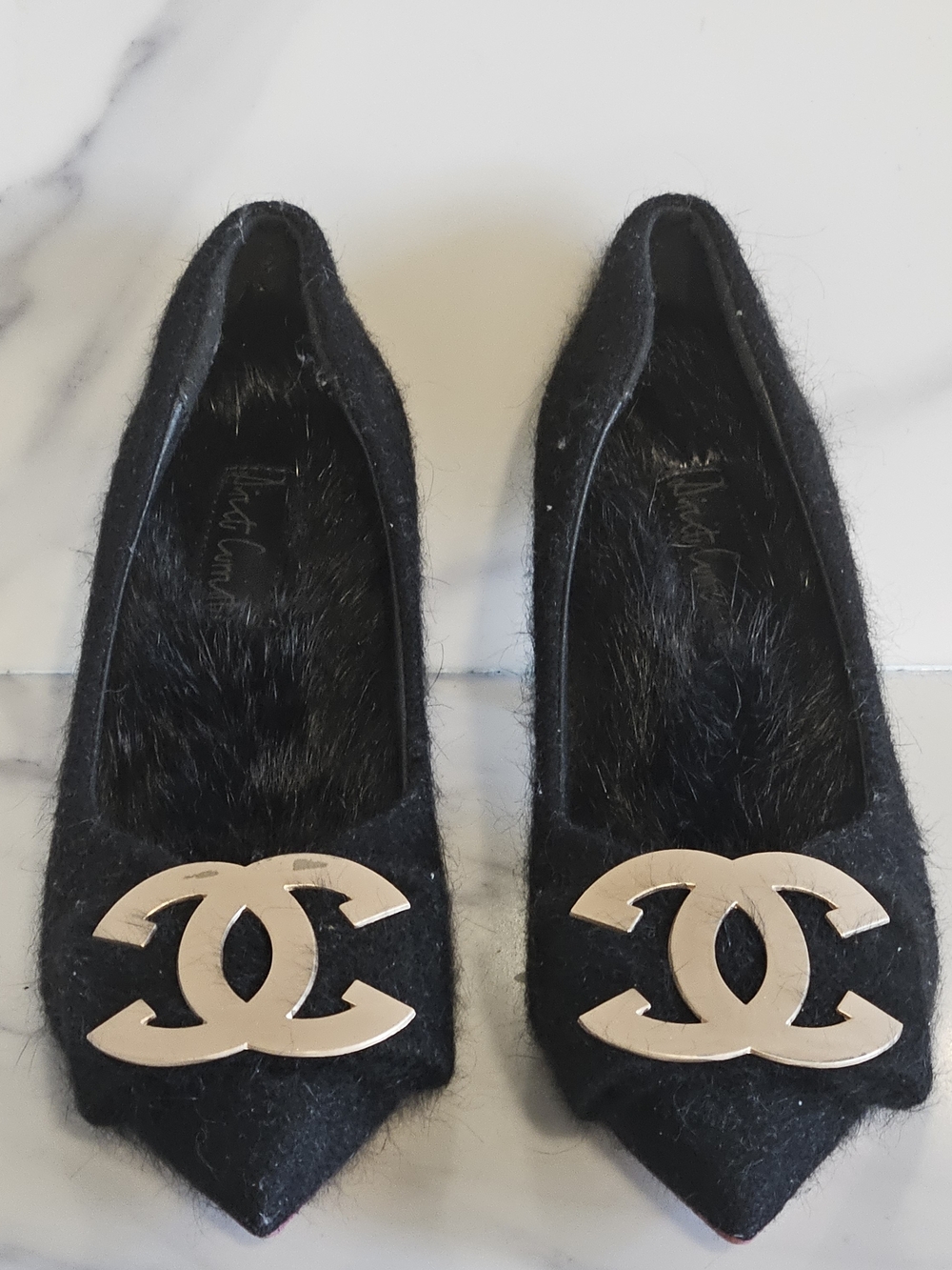 Black Pointed-Toe Haircalf Flats with Gold Logo Plaque